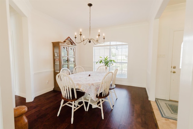 1503 S College Ave, Decatur, TX 76234 - dining space with a chandelier, wood finished floors, baseboards, and ornamental molding