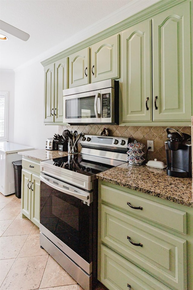 1503 S College Ave, Decatur, TX 76234 - kitchen with stainless steel appliances, green cabinetry, tasteful backsplash, ornamental molding, and light stone countertops