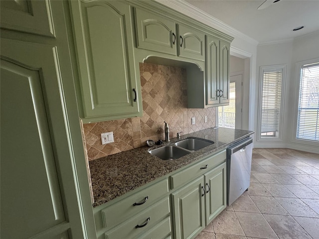 kitchen with a sink, green cabinetry, dishwasher, and tasteful backsplash