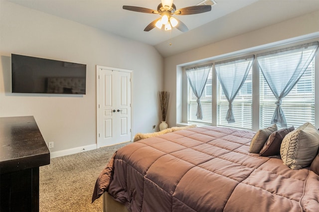 bedroom featuring baseboards, a ceiling fan, carpet, and vaulted ceiling