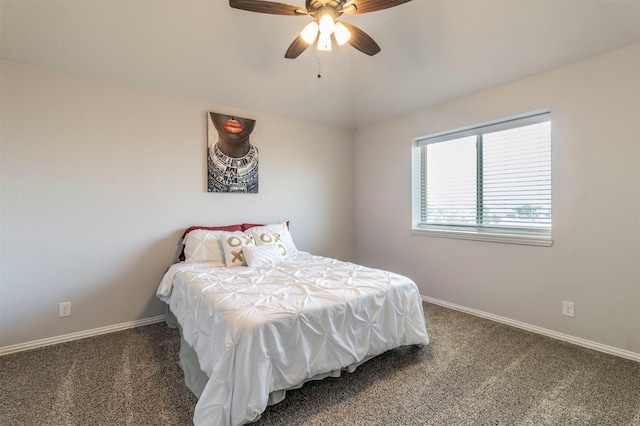 carpeted bedroom with baseboards and ceiling fan