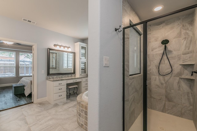 bathroom with a bath, visible vents, a stall shower, vanity, and ensuite bathroom