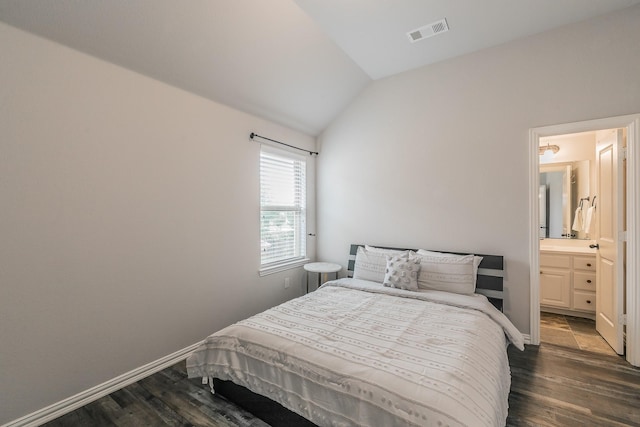 bedroom featuring baseboards, visible vents, dark wood-style floors, and lofted ceiling