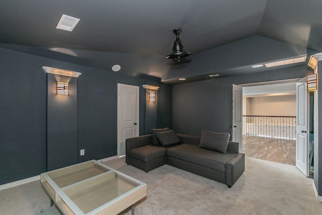 carpeted cinema with baseboards, a ceiling fan, and lofted ceiling