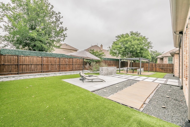 view of yard with a fenced backyard, a patio, and a gazebo
