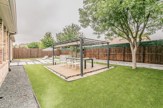 view of yard with a fenced backyard, a pergola, and a deck