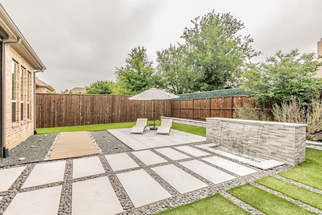 view of patio with a fenced backyard