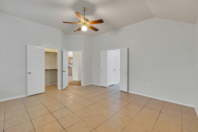 520 Jeff Grimes Blvd, Desoto, TX 75115 - unfurnished bedroom with a ceiling fan, baseboards, vaulted ceiling, and light tile patterned floors