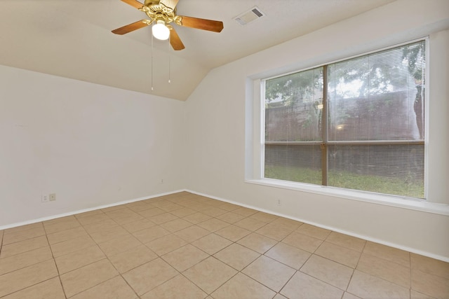 520 Jeff Grimes Blvd, Desoto, TX 75115 - unfurnished room with visible vents, baseboards, ceiling fan, light tile patterned floors, and vaulted ceiling