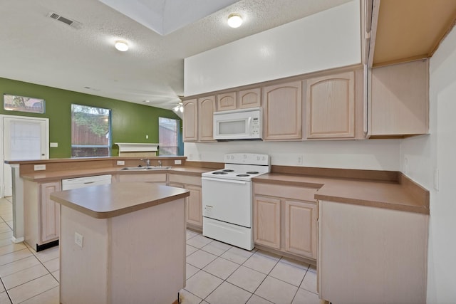 520 Jeff Grimes Blvd, Desoto, TX 75115 - kitchen with visible vents, light tile patterned floors, a peninsula, light brown cabinets, and white appliances