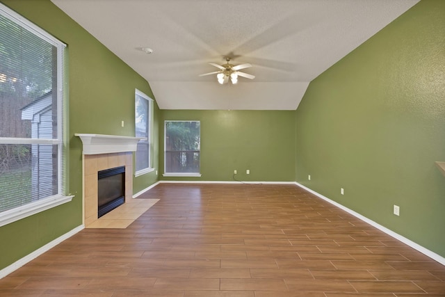 520 Jeff Grimes Blvd, Desoto, TX 75115 - unfurnished living room with ceiling fan, a fireplace, baseboards, wood finished floors, and lofted ceiling