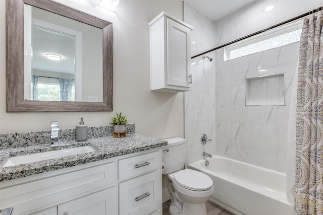 full bathroom featuring toilet, shower / bathtub combination with curtain, a wealth of natural light, and vanity