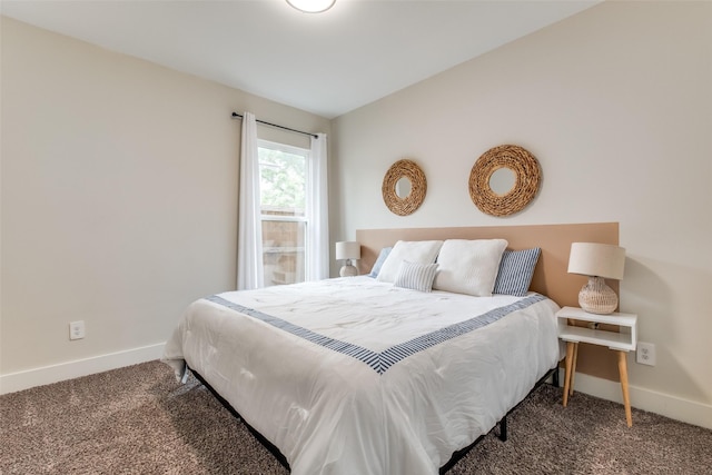 bedroom with carpet floors and baseboards