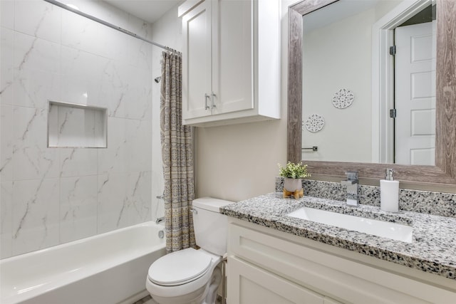 bathroom featuring vanity, toilet, and shower / tub combo