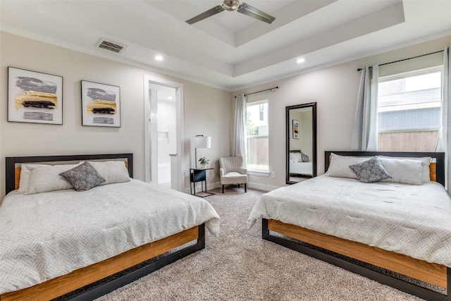 carpeted bedroom featuring visible vents, recessed lighting, a raised ceiling, and baseboards