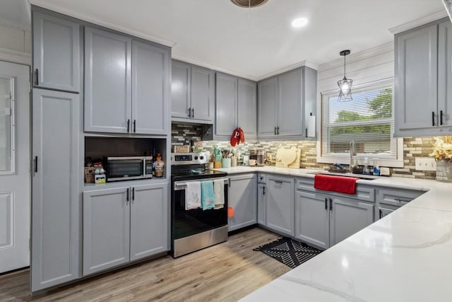 2019 W Belclaire Cir, Corsicana, TX 75110 - kitchen with a sink, appliances with stainless steel finishes, gray cabinets, and backsplash