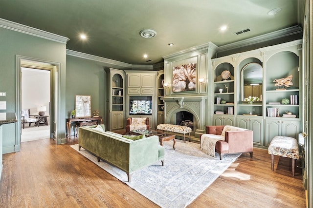 1304 Regency Ct, Southlake, TX 76092 - living area with ornamental molding, light wood-type flooring, a fireplace, recessed lighting, and built in shelves
