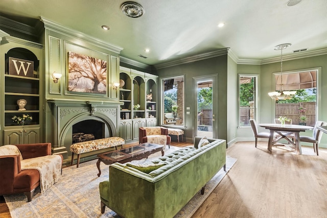 1304 Regency Ct, Southlake, TX 76092 - living area with healthy amount of natural light, light wood finished floors, a fireplace, baseboards, and crown molding