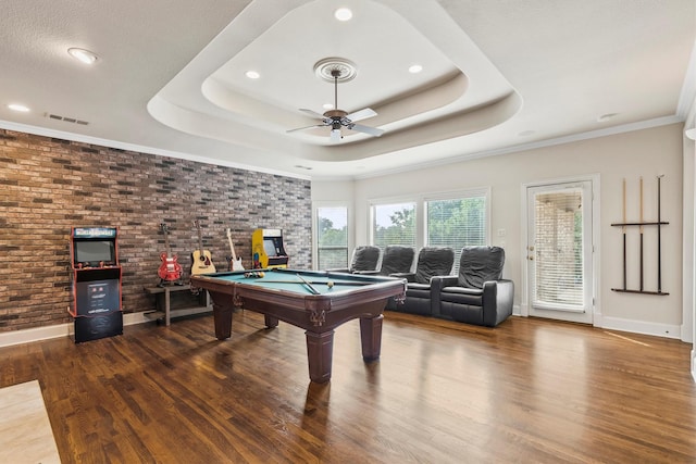 1304 Regency Ct, Southlake, TX 76092 - recreation room with pool table, a ceiling fan, a tray ceiling, wood finished floors, and recessed lighting
