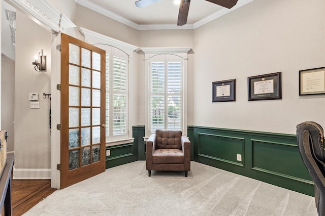 1304 Regency Ct, Southlake, TX 76092 - living area with a ceiling fan, crown molding, a wainscoted wall, and carpet flooring