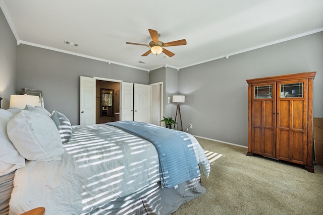 bedroom with crown molding, carpet flooring, baseboards, and visible vents