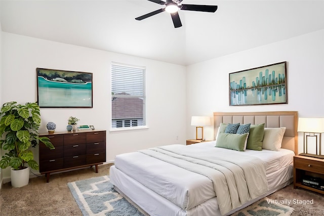 carpeted bedroom featuring ceiling fan and lofted ceiling