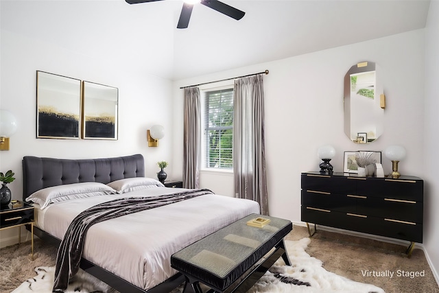 bedroom with baseboards, lofted ceiling, ceiling fan, and carpet