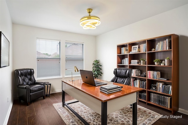 office space with baseboards and dark wood-style floors