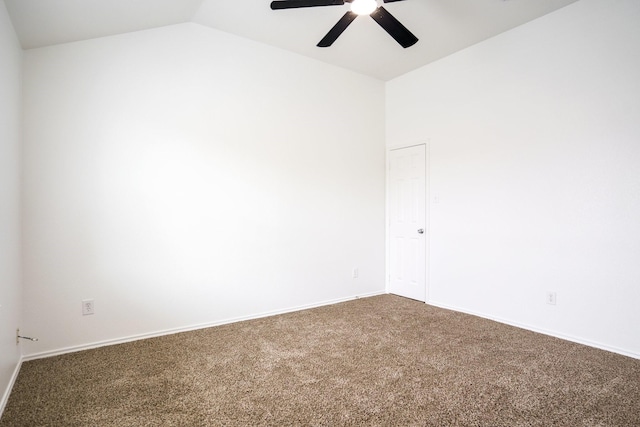 unfurnished room with carpet flooring, a ceiling fan, baseboards, and vaulted ceiling