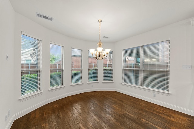 2026 Grassland Dr, Allen, TX 75013 - unfurnished dining area with an inviting chandelier, baseboards, dark wood-style flooring, and visible vents