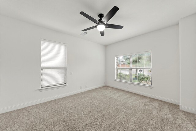 2026 Grassland Dr, Allen, TX 75013 - empty room featuring a ceiling fan, baseboards, visible vents, and light carpet