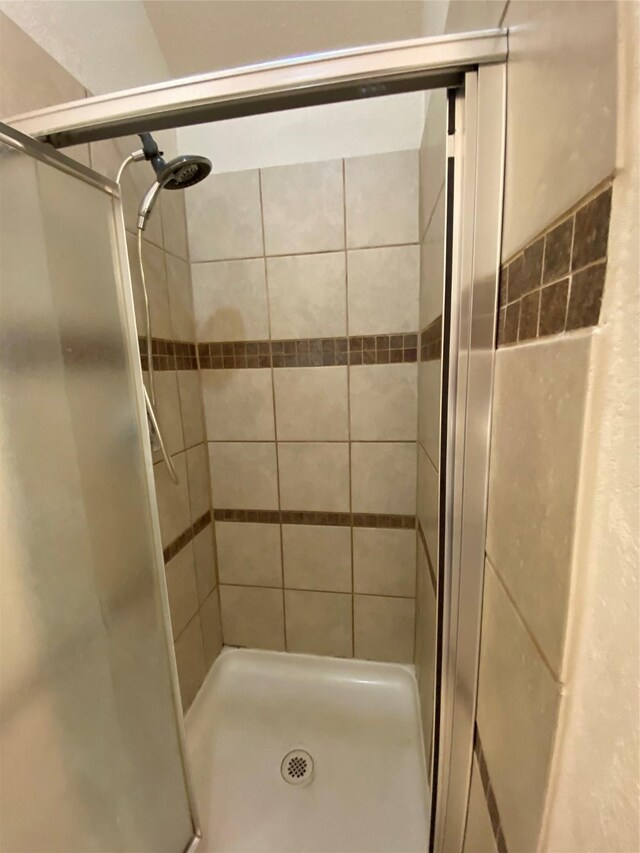 full bath featuring a stall shower