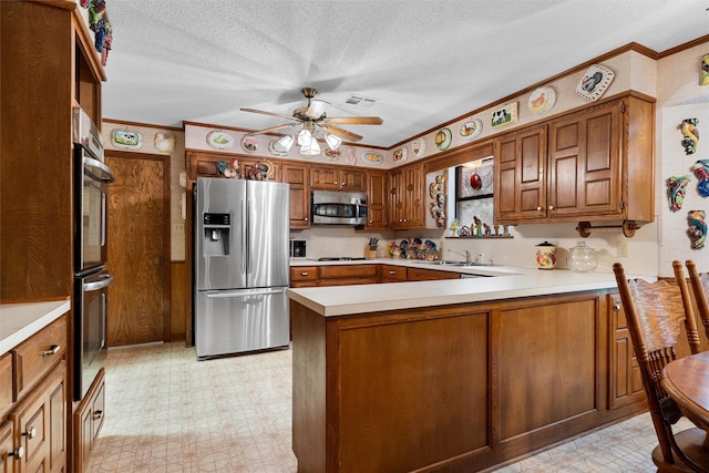 kitchen featuring light countertops, light floors, stainless steel appliances, and a sink