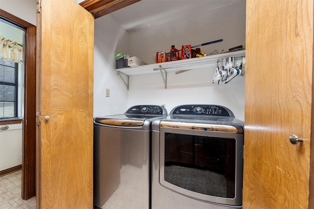 clothes washing area featuring laundry area and separate washer and dryer