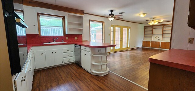 kitchen featuring a peninsula, open shelves, dark wood-style floors, and a sink