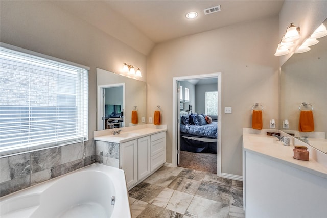 1821 Beacon Beach Way, Wylie, TX 75098 - bathroom featuring ensuite bathroom, vanity, a garden tub, baseboards, and recessed lighting