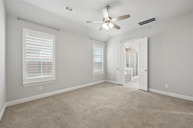 unfurnished bedroom featuring baseboards, visible vents, and light carpet