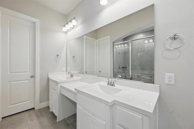 full bath featuring double vanity, a sink, tile patterned flooring, and a stall shower