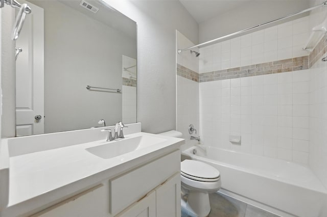 bathroom featuring shower / bath combination, visible vents, vanity, tile patterned floors, and toilet