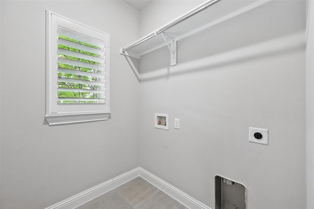 laundry area featuring laundry area, hookup for a washing machine, baseboards, and electric dryer hookup