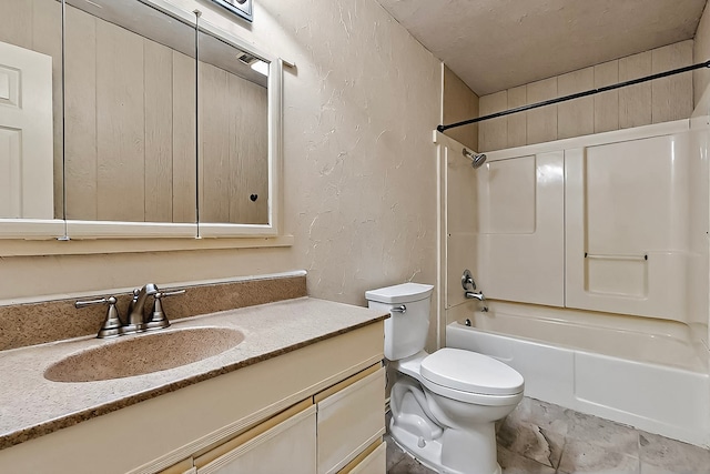 bathroom featuring shower / bathtub combination, toilet, a textured wall, and vanity