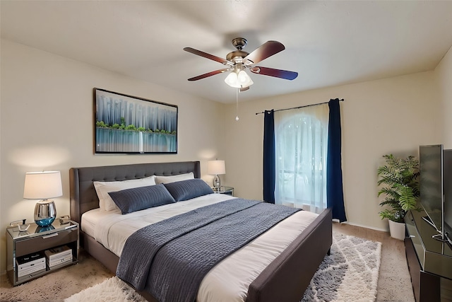 bedroom with baseboards, light colored carpet, and ceiling fan