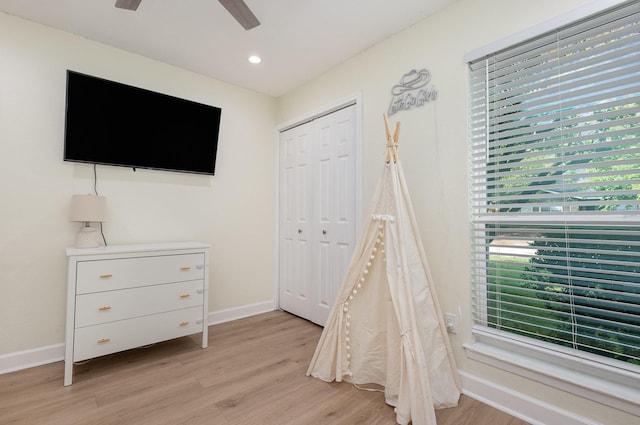 recreation room with light wood-style floors, baseboards, a ceiling fan, and recessed lighting