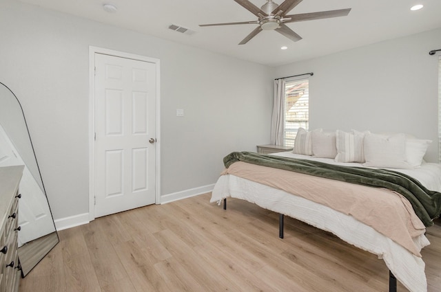 bedroom featuring light wood-type flooring, recessed lighting, baseboards, and a ceiling fan