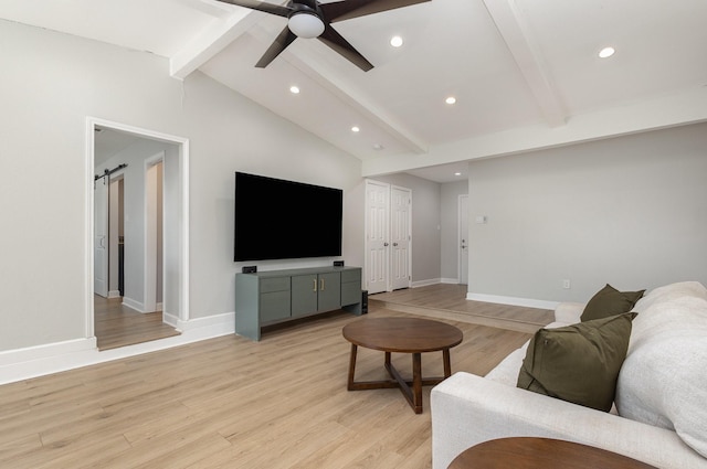 living area featuring recessed lighting, a ceiling fan, light wood-type flooring, baseboards, and a barn door