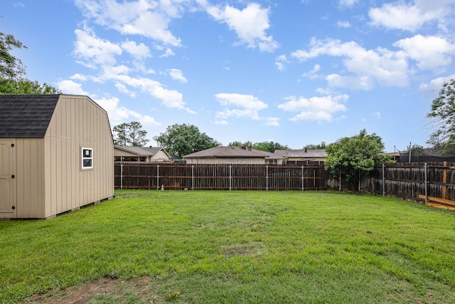 view of yard with an outdoor structure and a storage unit