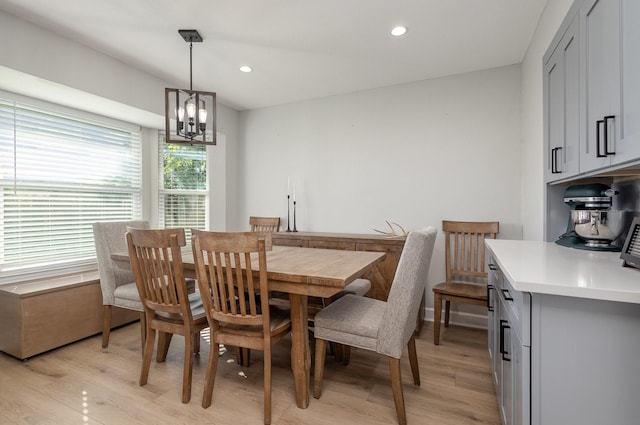 dining space with light wood-style floors, a chandelier, and recessed lighting