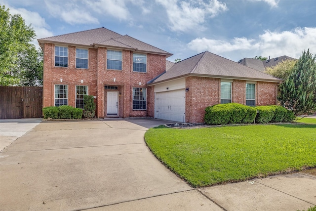 view of front of home with fence, a front yard, brick siding, concrete driveway, and an attached garage