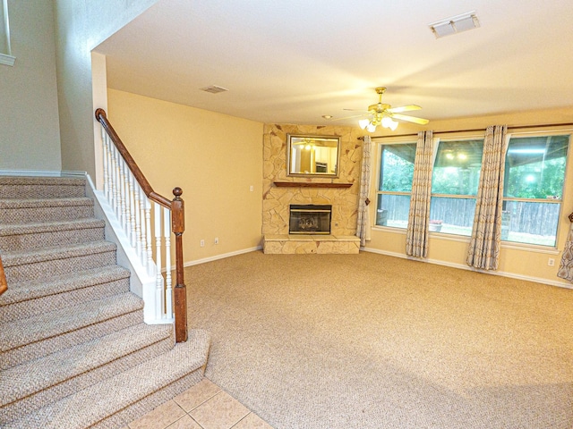 5320 Alta Loma Dr, Fort Worth, TX 76244 - unfurnished living room with a ceiling fan, a fireplace, stairway, and light carpet