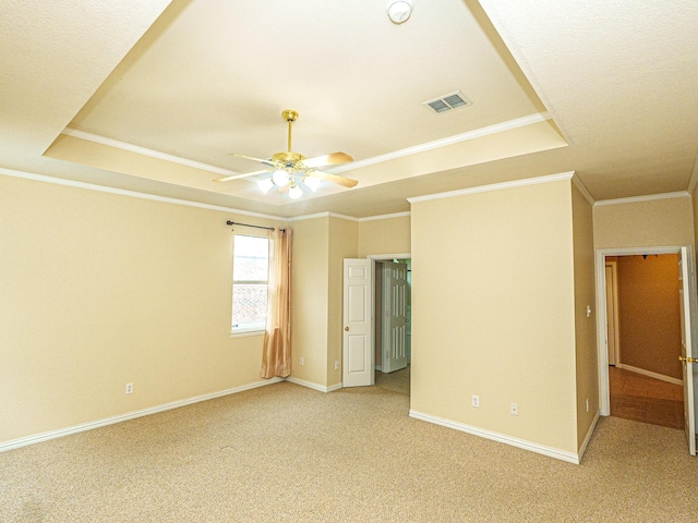 5320 Alta Loma Dr, Fort Worth, TX 76244 - unfurnished bedroom featuring a tray ceiling, light colored carpet, ornamental molding, and ceiling fan